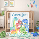 Blanket with colorful dinosaur design and 'Lawson Jace' text in a nursery setting.