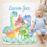 Baby lying on a dinosaur-themed mat with colorful illustrations and 'Lawson Jace' text.